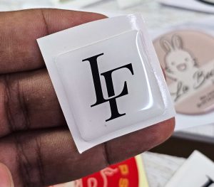 waterproof 3D logo stickers Dubai custom branded epoxy stickers abu Dhabi company logo epoxy stickers naif deira